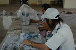 Sculptors working on creating sculptures in ceramics