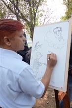 Vishwas Suryawanshi drawing his cartoon