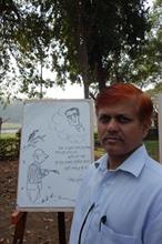 Vishwas Suryawanshi with his finished cartoon drawing