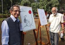 S. D. (Shi Da) Phadnis and Mangesh Tendulkar with their cartoons