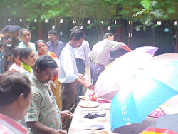Artist Dinkar Jadhav painting his umbrella