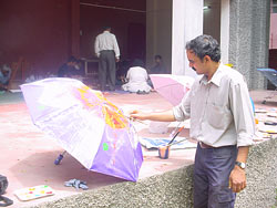 Artist  Dinkar Jadhav painting his umbrella