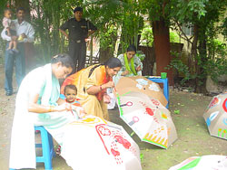 Participants enjoying the umbrella painting workshop