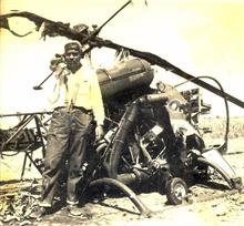 Prem Vaidya in front of a destroyed Pakistani helicopter, Indo-Pak war, 1965, Photo by Prem Vaidya