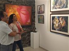 Amita Goswami with her paintings at Indiaart Gallery, Pune