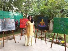 Rupal Buch with her paintings at the second edition of Emerging Artists Show at Indiaart Gallery, Pune