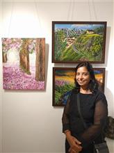 Sudha Srivastava with her paintings at the second edition of Emerging Artists Show at Indiaart Gallery, Pune
