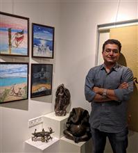 Vikram Jadhav with his parents at the second edition of Emerging Artists Show at Indiaart Gallery, Pune