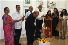 Milind Sathe lighting the lamp at the inauguration of the Emerging Artists show presented by Indiaart.com at Nehru Centre, MUmbai