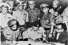 INSTRUMENT OF SURRENDER - signing at Dacca 16th December 1971 at 4.30 pm L to R- Lt. Gen Jagjit Singh Aurora, Gen AAK Niazi with Maj Gen JFR Jacob-  standing, Photo by Prem Vaidya