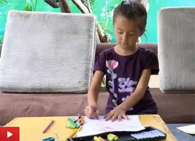 Young Yulia paints at Indiaart Gallery