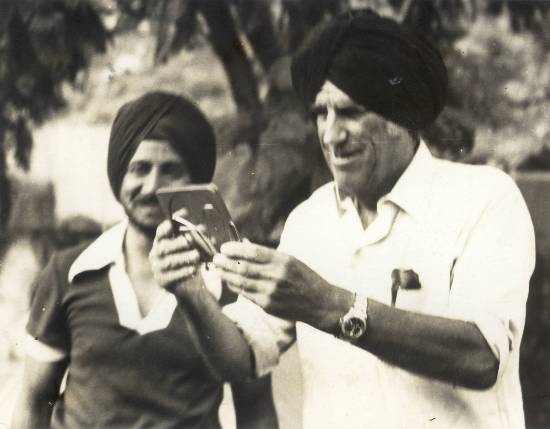 Photograph by Prem Vaidya - Hillary admiring himself in a turban, Nandaprayag, 1977, Ocean to Sky expedition