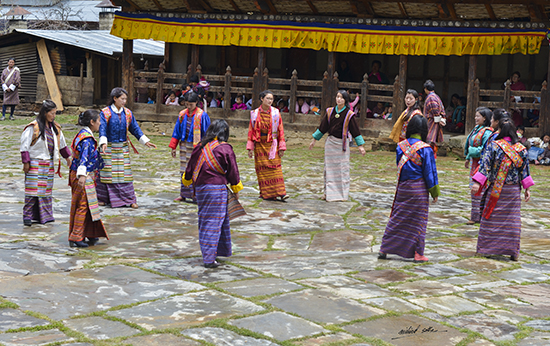 Photograph by Milind Sathe - Village women dancing at Ura festival, Bhutan